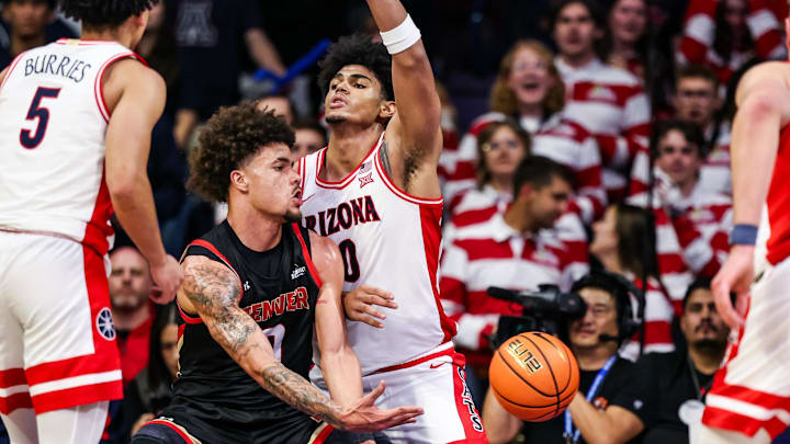 Nov 24, 2025; Tucson, Arizona, USA; Denver Pioneers forward Jeremiah Burke (0) passes the ball during the second half of the game against the Arizona Wildcats at McKale Memorial Center. Mandatory Credit: Aryanna Frank-Imagn Images Nov 24, 2025; Tucson, Arizona, USA; Denver Pioneers forward Jeremiah Burke (0) passes the ball during the second half of the game against the Arizona Wildcats at McKale Memorial Center. Mandatory Credit: Aryanna Frank-Imagn Images
