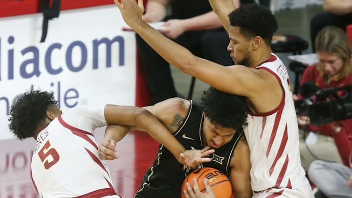 Iowa State Cyclones guard Curtis Jones (5) and forward Joshua Jefferson (2) put high pressure on UCF Knights guard Mikey Williams (1) and creating a turn over during the first half in the Big-12 men’s basketball at Hilton Coliseum onTuesday, Jan. 21, 2025 in Ames, Iowa.