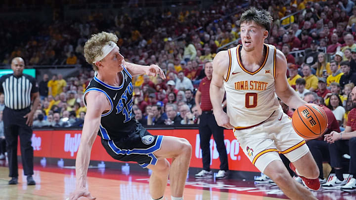 Iowa State Cyclones guard Nate Heise (0) drives with the ball around BYU Cougars's forward Richie Saunders (15) during the second over-time of the Big-12 men’s basketball in the Senior Day at Hilton Coliseum on March 4, 2025, in Ames, Iowa.