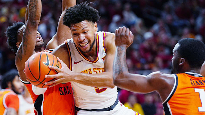 Iowa State Cyclones forward Joshua Jefferson (5) drives to the basket between Oklahoma State Cowboys guard Anthony Roy (9) and Oklahoma State Cowboys guard Kanye Clary (1) during the first half in the Big-12 men’s basketball on Jan. 10, 2026, at Hilton Coliseum in Ames, Iowa. Iowa State Cyclones forward Joshua Jefferson (5) drives to the basket between Oklahoma State Cowboys guard Anthony Roy (9) and Oklahoma State Cowboys guard Kanye Clary (1) during the first half in the Big-12 men’s basketball on Jan. 10, 2026, at Hilton Coliseum in Ames, Iowa.