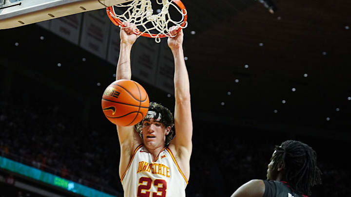 Iowa State Cyclones forward Blake Buchanan (23) dunks the ball around Texas Tech Red Raiders forward Luke Bamgboye (9) during the first half in the Big-12 conference men’s basketball showdown on Feb. 28, 2026, at Hilton Coliseum in Ames, Iowa.