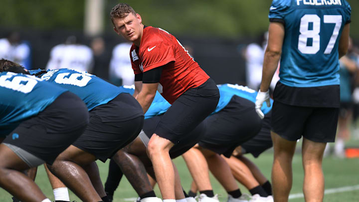 Jacksonville Jaguars quarterback Mac Jones (10) looks back at tight end Josh Pederson (87) during drills at the organized team activity session Monday, June 3, 2024 at EverBank Stadium's Miller Electric Center in Jacksonville, Fla.