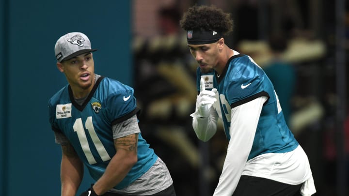 Jacksonville Jaguars wide receiver Parker Washington (11) lines up with tight end Shawn Bowman (49) during drills. The Jacksonville Jaguars let most of the veterans off from participating in Monday's mandatory minicamp session held in the air conditioned enclosed field at EverBank Stadium's Miller Electric Center in Jacksonville, Fla. June 10, 2024. [Bob Self/Florida Times-Union]