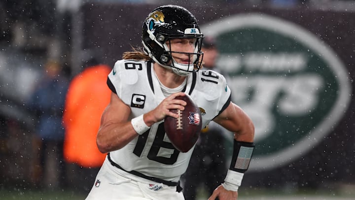Dec 22, 2022; East Rutherford, New Jersey, USA; Jacksonville Jaguars quarterback Trevor Lawrence (16) runs with the ball against the New York Jets during the first half at MetLife Stadium. Mandatory Credit: Ed Mulholland-Imagn Images