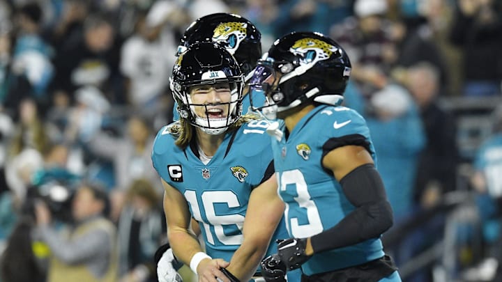 Jacksonville Jaguars quarterback Trevor Lawrence (16) celebrates with teammate wide receiver Christian Kirk (13) after his touchdown catch during second quarter action. The Jacksonville Jaguars hosted the Tennessee Titans to decide the AFC South championship at TIAA Bank Field in Jacksonville, FL, Saturday, January 7, 2023. The Jaguars went into the half trailing 7 to 13. [Bob Self/Florida Times-Union]

Jki 010723 Bs Jaguars Vs T 6