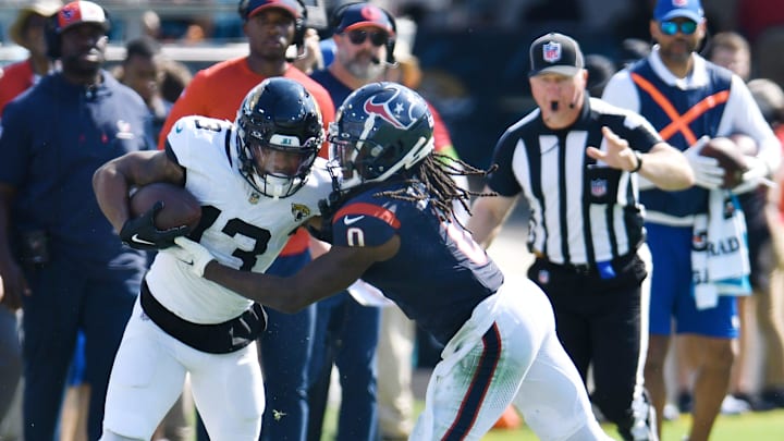 Houston Texans cornerback Shaquill Griffin (0) pushes Jacksonville Jaguars wide receiver Christian Kirk (13) out of bounds on a fourth quarter pass play for a first down. The Jacksonville Jaguars hosted the Tennessee Titans at EverBank Stadium in Jacksonville, Fla. Sunday, September 24, 2023. The Jaguars trailed 17 to 0 at the end of the first half and lost with a final score of 37-17. [Bob Self/Florida Times-Union]