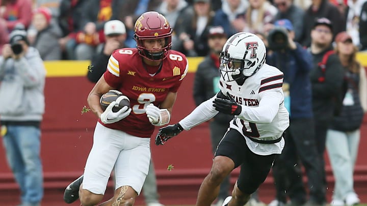 Iowa State Cyclones wide receiver Jayden Higgins (9) runs with the ball after making a catch around Texas Tech Red Raiders' defensive back Bralyn Lux (0) during the first quarter in the week-10 NCAA football at Jack Trice Stadium on Saturday, Nov. 2, 2024, in Ames, Iowa. Iowa State Cyclones wide receiver Jayden Higgins (9) runs with the ball after making a catch around Texas Tech Red Raiders' defensive back Bralyn Lux (0) during the first quarter in the week-10 NCAA football at Jack Trice Stadium on Saturday, Nov. 2, 2024, in Ames, Iowa.