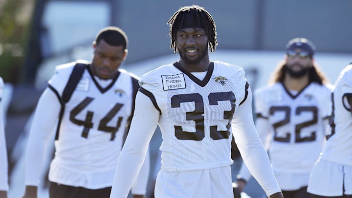 Jacksonville Jaguars linebacker Devin Lloyd (33) and teammates arrive at the practice fields for the start of Wednesday morning's training camp session. The Jacksonville Jaguars held their third day of training camp Wednesday, July 27, 2022, at the Episcopal School of Jacksonville Knight Campus practice fields on Atlantic Blvd. [Bob Self/Florida Times-Union]

Jaguars LB Devin Lloyd walks in front of OLB Travon Walker during training camp