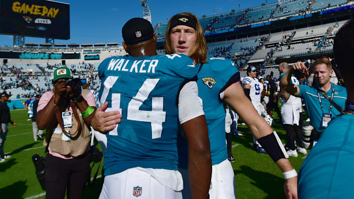 Jacksonville Jaguars quarterback Trevor Lawrence (16) hugs teammate linebacker Travon Walker (44) after Sunday's victory over the Indianapolis Colts. The Jacksonville Jaguars hosted the Indianapolis Colts at EverBank Stadium in Jacksonville, FL Sunday, October 15, 2023. The Jaguars ended the first half with a 21 to 6 lead and won with a final score of 37 to 20.