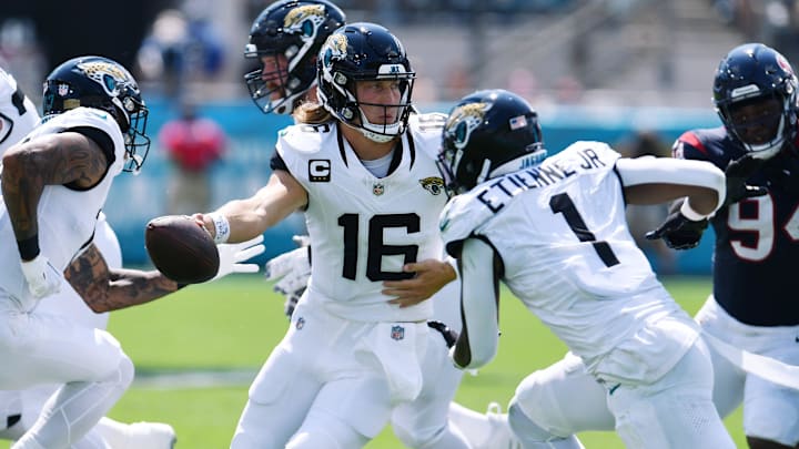 Jacksonville Jaguars quarterback Trevor Lawrence (16) fakes a handoff to running back Travis Etienne Jr. (1) on what turned out to be a first down pass play during second quarter action. The Jacksonville Jaguars hosted the Houston Texans at EverBank Stadium in Jacksonville, Fla. Sunday, September 24, 2023. The Jaguars trailed 17 to 0 at the end of the first half. [Bob Self/Florida Times-Union]