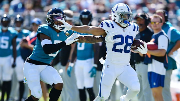 Indianapolis Colts running back Jonathan Taylor (28) pushes off Jacksonville Jaguars safety Andre Cisco (5) on a 40 yard pass play down the sideline during second quarter action. The Jacksonville Jaguars hosted the Indianapolis Colts at EverBank Stadium in Jacksonville, FL Sunday, October 15, 2023. The Jaguars ended the first half with a 21 to 6 lead. [Bob Self/Florida Times-Union]