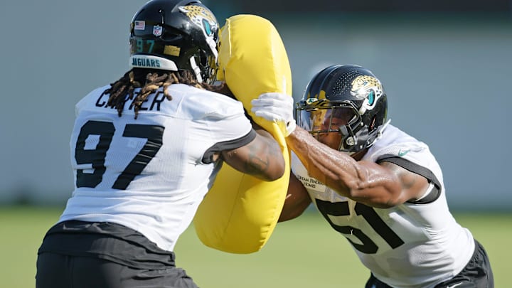 Jacksonville Jaguars linebacker Ventrell Miller (51) goes up against defensive end Andre Carter (97) in drills during the fourth day of the NFL football training camp practice session Saturday, July 27, 2024 at EverBank Stadium's Miller Electric Center in Jacksonville, Fla. [Bob Self/Florida Times-Union]