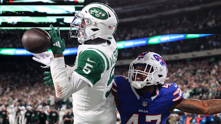 Oct 14, 2024; East Rutherford, New Jersey, USA; Buffalo Bills cornerback Christian Benford (47) knocks the ball away from New York Jets wide receiver Garrett Wilson (5) during the second half at MetLife Stadium. 
