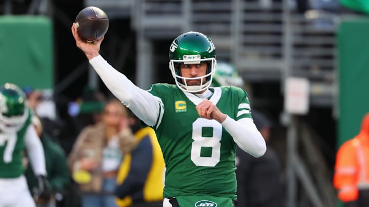Jan 5, 2025; East Rutherford, New Jersey, USA; New York Jets quarterback Aaron Rodgers (8) throws a pass during pregame warmups for their game against the Miami Dolphins at MetLife Stadium. Mandatory Credit: Ed Mulholland-Imagn Images