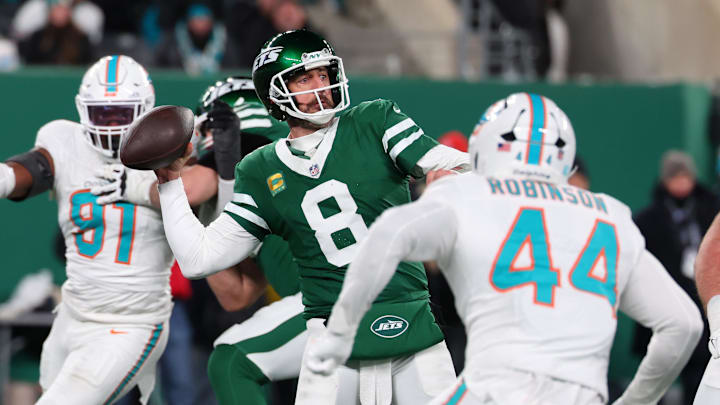 Jan 5, 2025; East Rutherford, New Jersey, USA; New York Jets quarterback Aaron Rodgers (8) throws a pass during the third quarter of their game against the Miami Dolphins at MetLife Stadium. Mandatory Credit: Ed Mulholland-Imagn Images