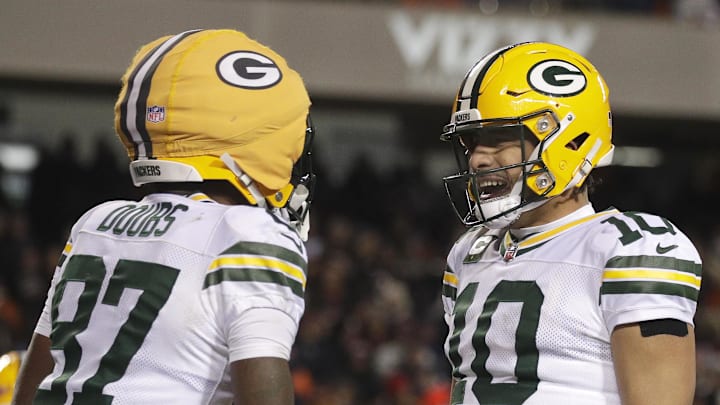 Jan 10, 2026; Chicago, IL, USA; Green Bay Packers quarterback Jordan Love (10) and wide receiver Romeo Doubs (87) celebrate a second quarter touchdown against the Chicago Bears in an NFC Wild Card Round game at Soldier Field. Mandatory Credit: Wm. Glasheen/USA TODAY Network via Imagn Images