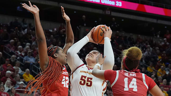 Iowa State Cyclones' center Audi Crooks (55) shoots the ball between Houston Cougars forward Peyton McFarland (42) and guard Laila Blair (14) during the second quarter in the Big-12 women’s basketball at Hilton Coliseum on Wednesday, Feb19, 2025, in Ames, Iowa. Iowa State Cyclones' center Audi Crooks (55) shoots the ball between Houston Cougars forward Peyton McFarland (42) and guard Laila Blair (14) during the second quarter in the Big-12 women’s basketball at Hilton Coliseum on Wednesday, Feb19, 2025, in Ames, Iowa.