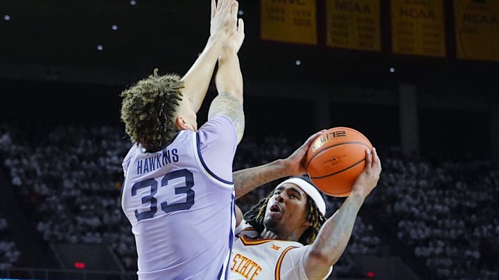 Iowa State Cyclones guard Keshon Gilbert (10) shoots the ball as Kansas State Wildcats' forward Coleman Hawkins (33) attempts to block during the second half in the Big-12 men’s basketball showdown at Hilton Coliseum on Feb 1, 2025 in Ames, Iowa.