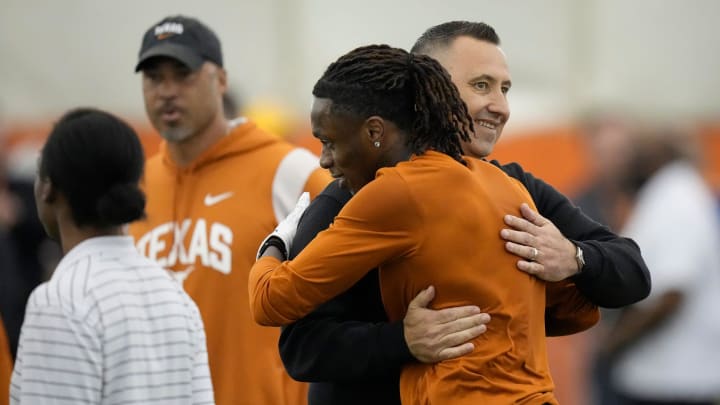 Wide receiver Xaver Worthy hugs head coach Steve Sarkisian at Texas Longhorns Football Pro Day at Frank Denius Fields Wednesday March 20, 2024.