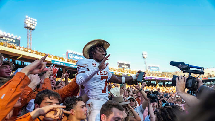 ]Texas Longhorns defensive back Jahdae Barron (7) celebrates with fans after beating Oklahoma Sooners 34-3 in the Red River Rivalry Football Game at the Cotton Bowl Stadium in Dallas, TX on Saturday Oct. 12, 2024.