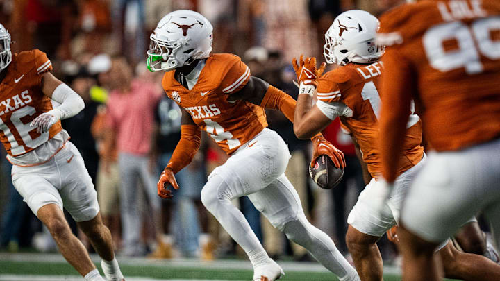 Texas Longhorns defensive back Andrew Mukuba (4) runs across the field with the ball to celebrate an interception in the first quarter of the Longhorns' game against the Georgia Bulldogs at Darrell K. Royal Texas Memorial Stadium in Austin, Oct. 19, 2024.
