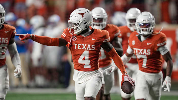 Nov 23, 2024; Austin, Texas, USA; Texas Longhorns defensive back Andrew Mukuba (4) celebrates after a interception against Kentucky Wildcats late in the fourth quarter at Darrell K Royal Texas Memorial Stadium. Mandatory Credit: Ricardo B. Brazziell/USA TODAY Network via Imagn Images