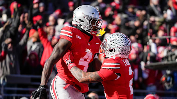 Ohio State Buckeyes wide receiver Emeka Egbuka (2) celebrates a touchdown by wide receiver Jeremiah Smith (4) during the NCAA football game against the Michigan Wolverines at Ohio Stadium in Columbus on Tuesday, Dec. 3, 2024. Michigan won 13-10.