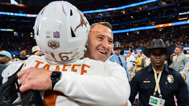 Texas Longhorns head coach Steve Sarkisian embraces Texas Longhorns defensive back Michael Taaffe (16) as they celebrate their win in the Peach Bowl College Football Playoff quarterfinal against Arizona State at Mercedes-Benz Stadium in Atlanta, Georgia, Jan. 1, 2025. Texas Longhorns head coach Steve Sarkisian embraces Texas Longhorns defensive back Michael Taaffe (16) as they celebrate their win in the Peach Bowl College Football Playoff quarterfinal against Arizona State at Mercedes-Benz Stadium in Atlanta, Georgia, Jan. 1, 2025.