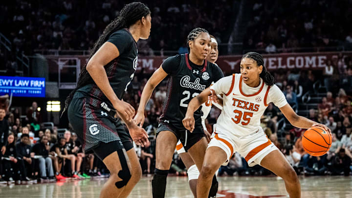 Texas Longhorns forward Madison Booker (35) drives into the let around South Carolina Gamecocks defense in the second half as the Longhorns take on the Gamecocks at the Moody Center, Feb. 9, 2025. Texas won the game 66-62.