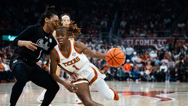 Texas Longhorns guard Bryanna Preston (1) drives past defense from South Carolina Gamecocks guard Maddy McDaniel (1) as the Texas Longhorns take on the Gamecocks at the Moody Center, Feb. 9, 2025.