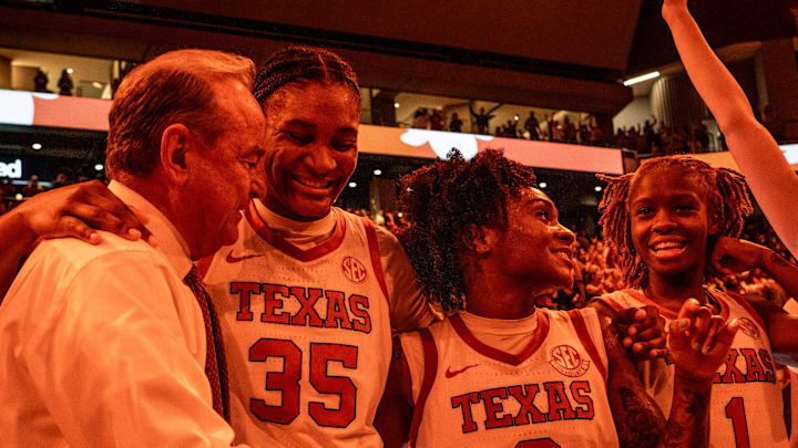 Texas Longhorns head coach Vic Schaefer celebrates with his team after Texas beat the South Carolina Gamecocks 66-62 at home in Austin at the Moody Center, Feb. 9, 2025.