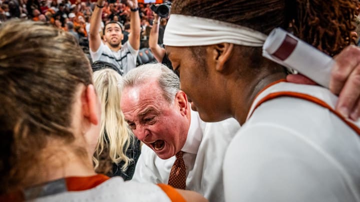 Texas Longhorns head coach Vic Schaefer celebrates with his team after Texas beat the South Carolina Gamecocks 66-62 at home in Austin at the Moody Center, Feb. 9, 2025.