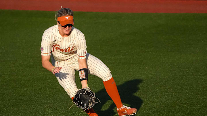Texas Longhorns outfielder Ashton Maloney (7) picks up a ground ball during the game against South Florida on the first day of the Longhorn Invitational on Friday, Feb. 28, 2025 in Austin.