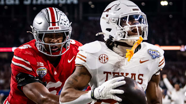 Texas Longhorns running back Jaydon Blue (23) runs into the end zone to score after catching a pass from quarterback Quinn Ewers (3) while Ohio State Buckeyes safety Sonny Styles (6) runs to defend late in the second quarter as the Texas Longhorns play the Ohio State Buckeyes in the Cotton Bowl College Football Playoff semi-final at AT&T Stadium in Dallas, Texas, Jan. 10, 2025. Texas Longhorns running back Jaydon Blue (23) runs into the end zone to score after catching a pass from quarterback Quinn Ewers (3) while Ohio State Buckeyes safety Sonny Styles (6) runs to defend late in the second quarter as the Texas Longhorns play the Ohio State Buckeyes in the Cotton Bowl College Football Playoff semi-final at AT&T Stadium in Dallas, Texas, Jan. 10, 2025.