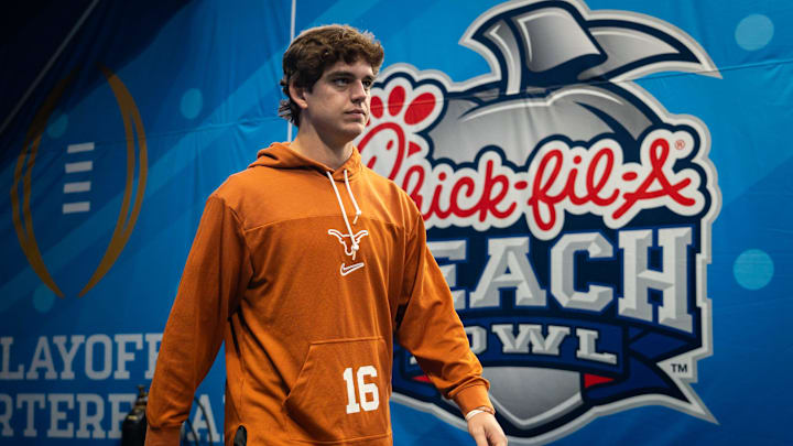 Texas Longhorns quarterback Arch Manning (16) walks onto the field as the Texas Longhorns prepare to play the Arizona State Sun Devils in the Peach Bowl College Football Playoff quarterfinal at Mercedes-Benz Stadium in Atlanta, Georgia, Jan. 1, 2025.
