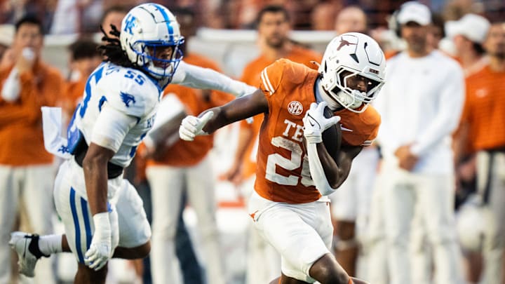 Texas Longhorns running back Quintrevion Wisner (26) carries the ball for Texas in the third quarter of the Texas Longhorns' game against the Kentucky Wildcats at Darrell K Royal Texas Memorial Stadium in Austin, Nov. 23, 2024.
