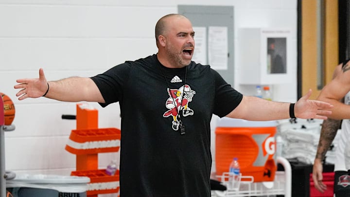 Assistant basketball coach Brian Kloman works with the Cardinals during practice before the team leaves for the Bahamas. July 26, 2024
