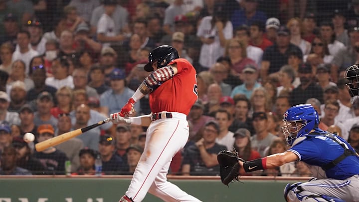 Boston Red Sox second baseman Michael Chavis (23) gets a base hit against the Toronto Blue Jays in the fourth inning at Fenway Park in 2021.