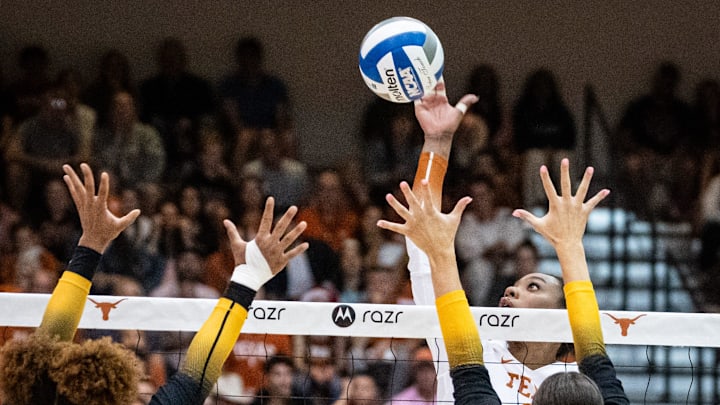 Texas Longhorns middle blocker Marianna Singletary (11) hits the ball over the net during the Longhorns' match-up with the Missouri Tigers at the Gregory Gym in Austin, Nov. 1, 2024. Texas Longhorns middle blocker Marianna Singletary (11) hits the ball over the net during the Longhorns' match-up with the Missouri Tigers at the Gregory Gym in Austin, Nov. 1, 2024.