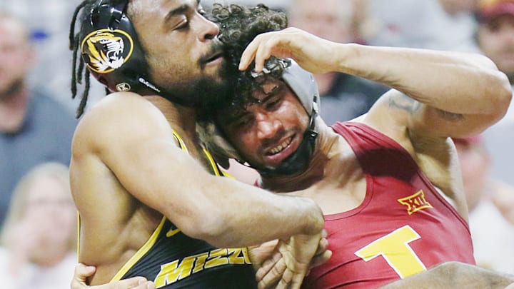 Iowa State Cyclones Anthony Echemendia takes down Missouri Tigers' Josh Edmond during their 141-pound wrestling in the Big-12-conference showdown at Hilton Coliseum on Sunday, Feb. 25, 2024, in Ames, Iowa