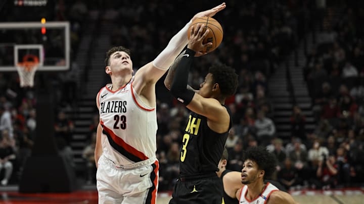 Oct 18, 2024; Portland, Oregon, USA; Utah Jazz guard Keyonte George (3) passes the ball against Portland Trail Blazers center Donovan Clingan (23) during the first half against at Moda Center. Mandatory Credit: Troy Wayrynen-Imagn Images