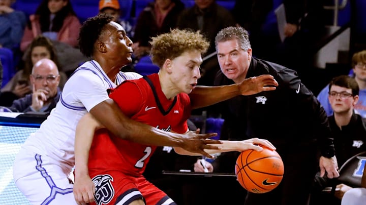 Middle Tennessee guard Camryn Weston (24) fouls Liberty guard Taelon Peter (2) as he tries to take the ball up the court during the Mens’ Basketball game at MTSU, on Thursday, March 6, 2025.