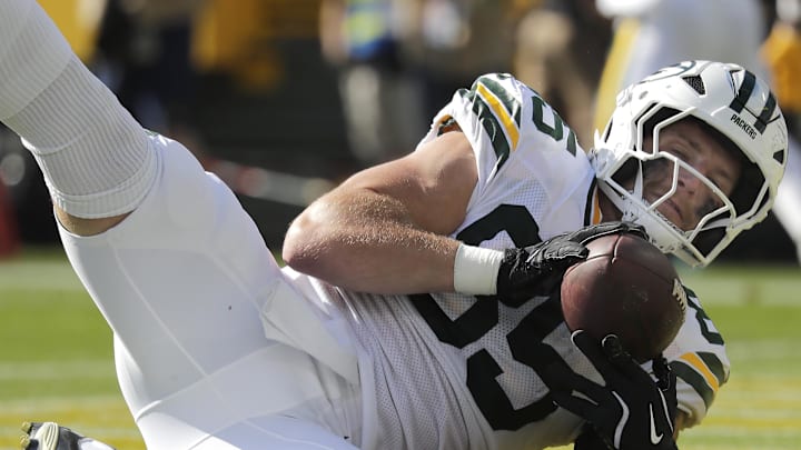 Oct 20, 2024; Green Bay, Wisconsin, USA; Green Bay Packers tight end Tucker Kraft (85) catches a first half touchdown pass against the Houston Texans at Lambeau Field. Mandatory Credit: William Glasheen/Appleton Post-Crescent via the USA TODAY NETWORK-Wisconsin-Imagn Images