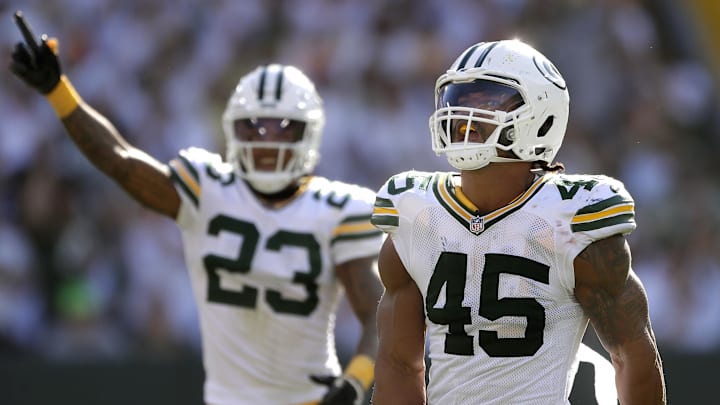 Green Bay Packers linebacker Eric Wilson (45) and cornerback Jaire Alexander (23) celebrate a stop against the Houston Texans,