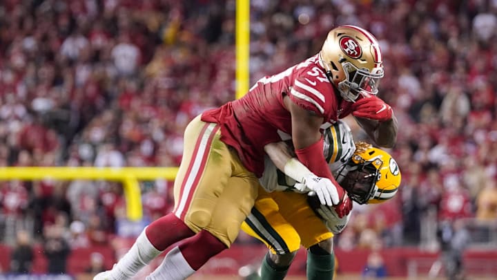 San Francisco 49ers linebacker Dre Greenlaw tackles former Green Bay Packers running back Aaron Jones. San Francisco 49ers linebacker Dre Greenlaw tackles former Green Bay Packers running back Aaron Jones.