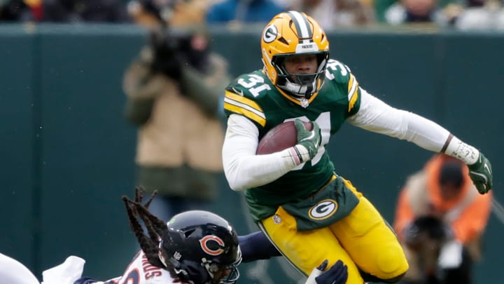 Green Bay Packers running back Emanuel Wilson (31) breaks away from Chicago Bears linebacker Tremaine Edmunds. Green Bay Packers running back Emanuel Wilson (31) breaks away from Chicago Bears linebacker Tremaine Edmunds.