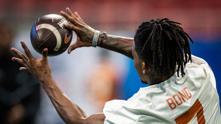 Texas Longhorns wide receiver Isaiah Bond (7) catches a pass at practice before a game against Georgia. Texas Longhorns wide receiver Isaiah Bond (7) catches a pass at practice before a game against Georgia.