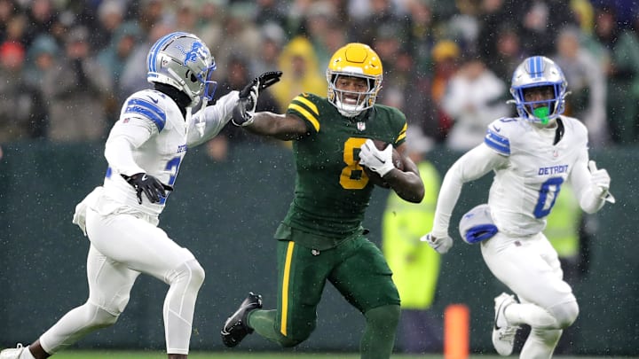 Green Bay Packers running back Josh Jacobs (8) stiff-arms Detroit Lions safety Kerby Joseph during last year's game at Lambeau Field. Green Bay Packers running back Josh Jacobs (8) stiff-arms Detroit Lions safety Kerby Joseph during last year's game at Lambeau Field.