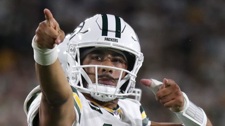 Green Bay Packers quarterback Jordan Love signals a first down against the Commanders on Thursday.