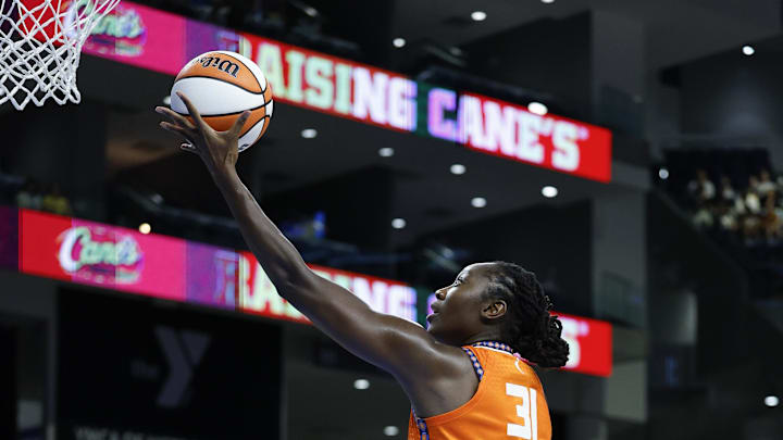 Aug 23, 2025; Chicago, Illinois, USA; Connecticut Sun center Tina Charles (31) goes to the basket against Chicago Sky forward Angel Reese (5) during the first half at Wintrust Arena. Mandatory Credit: Kamil Krzaczynski-Imagn Images